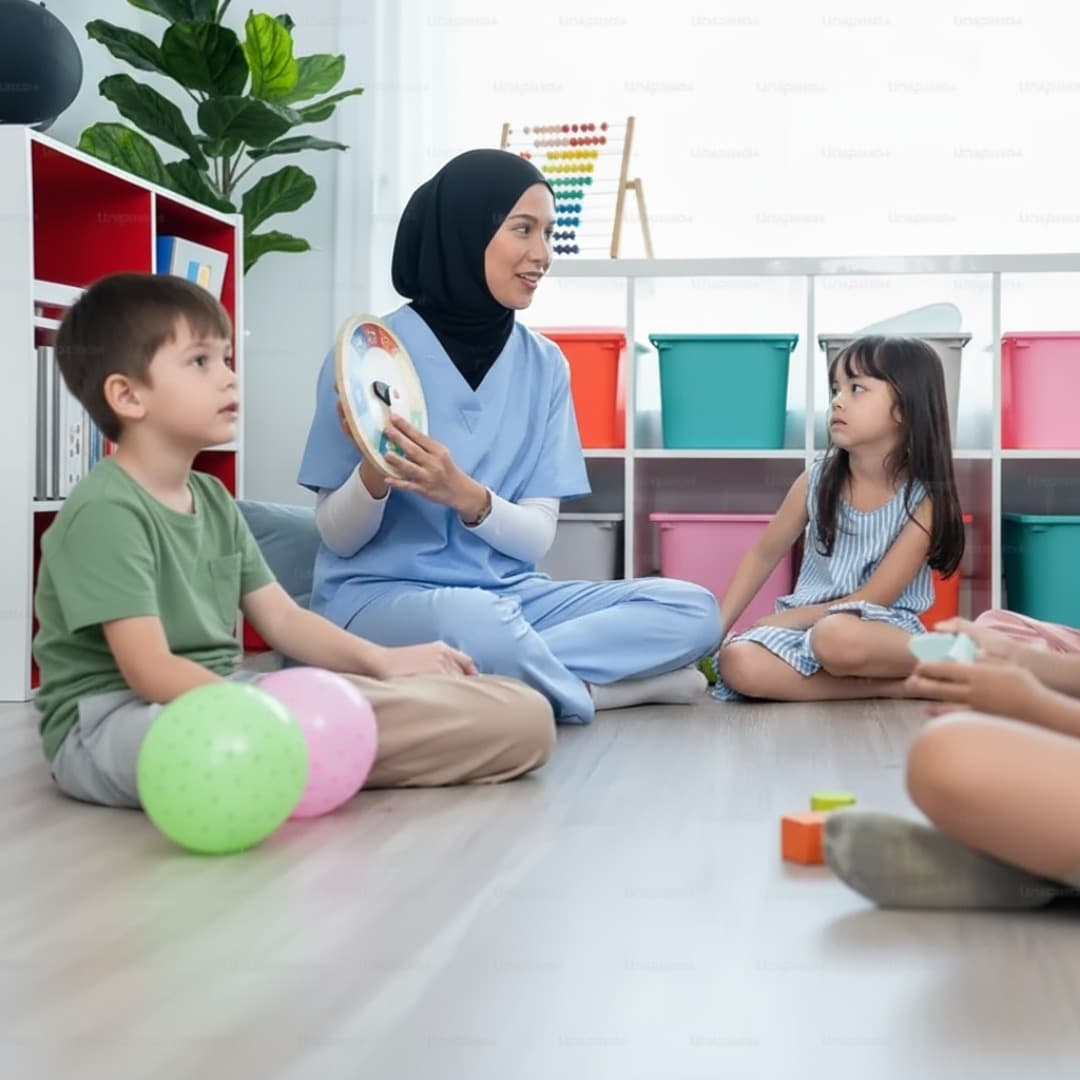 Professional nanny interacting with children